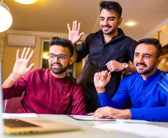friends from india talking in living room and have fun